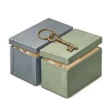Painted illustration of a brass skeleton key resting across two archival file boxes